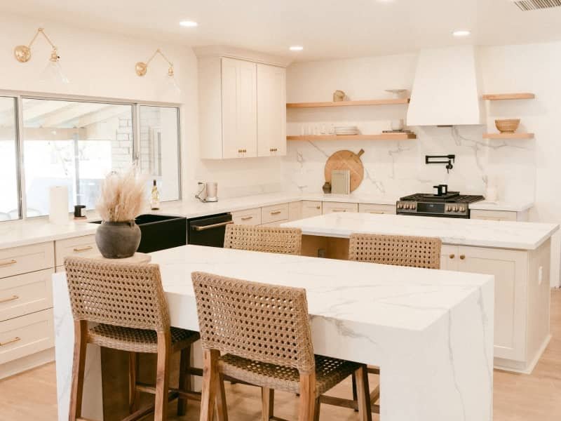 modern white kitchen with double cascade countertop islands in the Lansing-East Lansing Area | American Flooring |