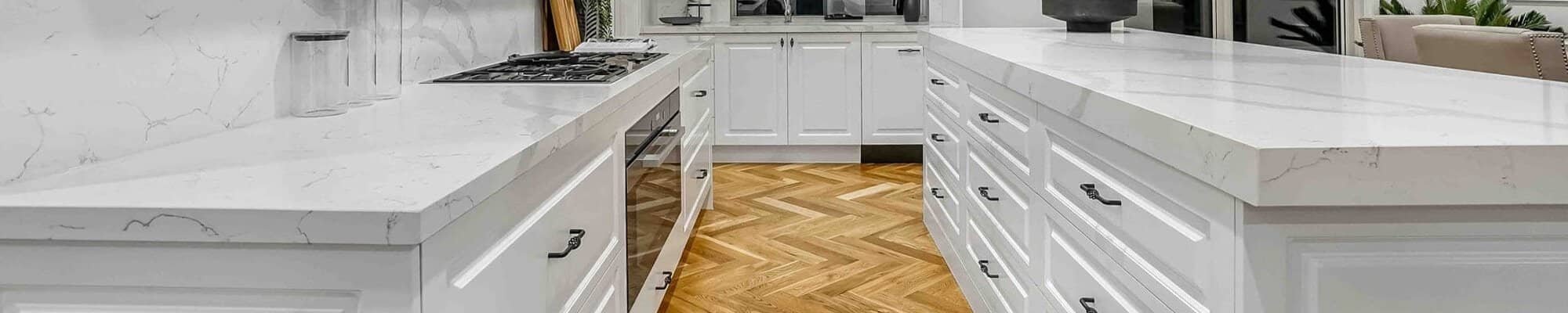 white kitchen with white marble countertops